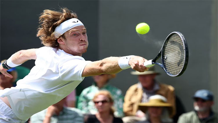 Rublev downs fellow Russian Karatsev to reach third round