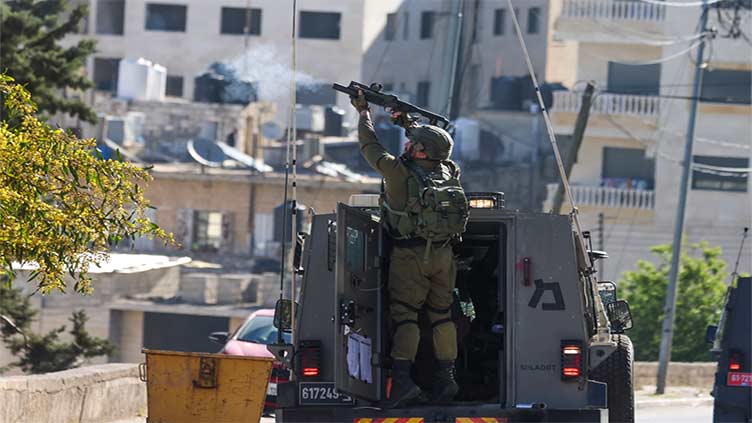 Israeli forces kill two Palestinian gunmen in West Bank raid