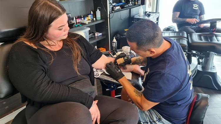 Fans get inked for lasting impressions of Wimbledon