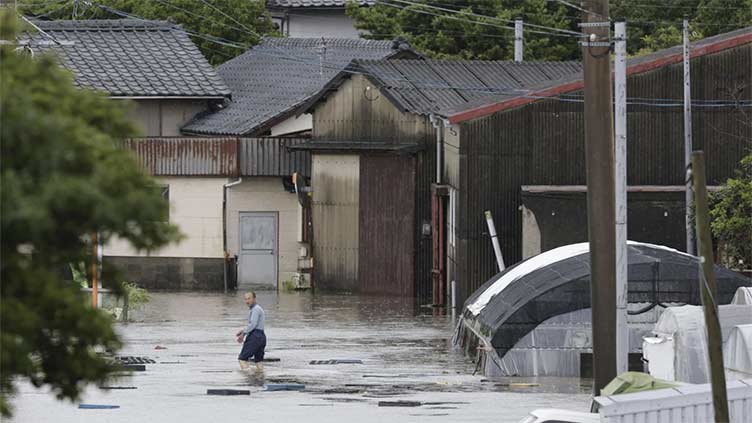 Heavy rains cause flooding and mudslides in southwest Japan, leaving 2 dead and at least 6 missing