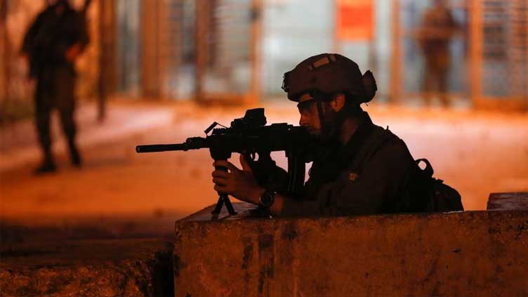 Palestinian opens fire at Israeli soldiers and is shot dead