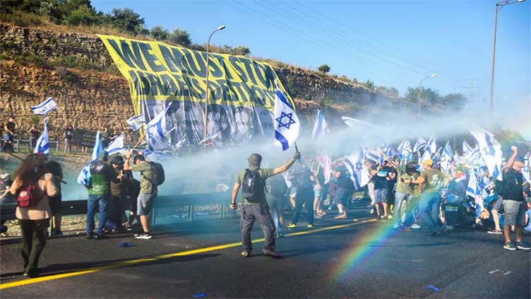 Police arrest 24 as protests erupt across Israel after first Knesset nod to contested Supreme Court bill
