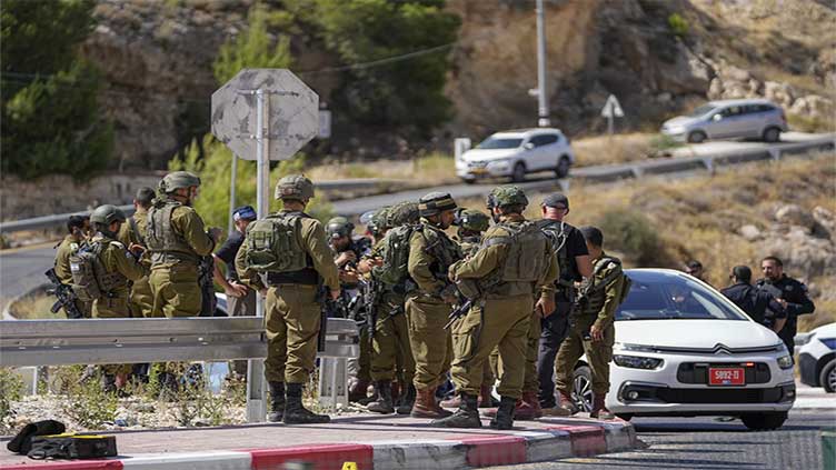Palestinian gunman opens fire on a car in the occupied West Bank, wounding 3, including 2 girls