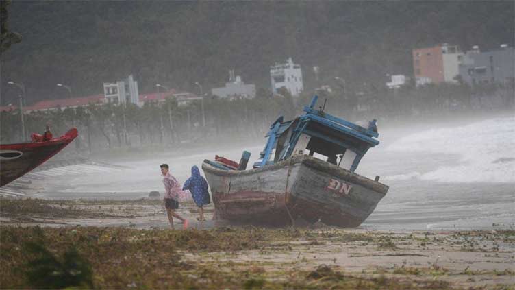 Thousands evacuated as typhoon nears southern China, Vietnam