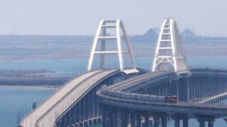Russian tourists flee Crimea after attack on landmark bridge
