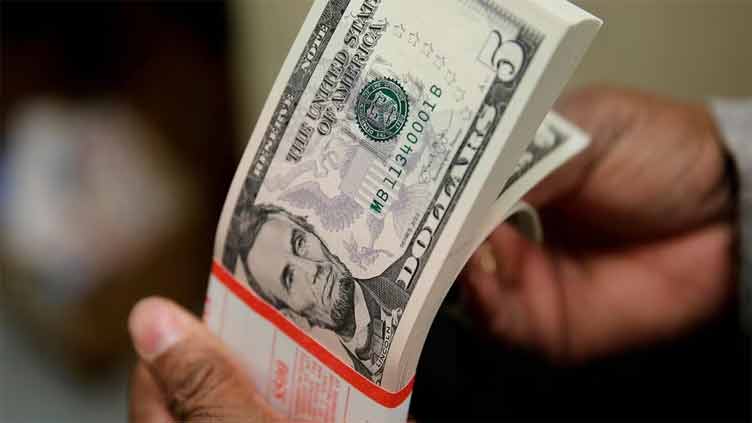 Dollar teeters near one-year low, euro scales 17-month peak during Tuesday morning trading