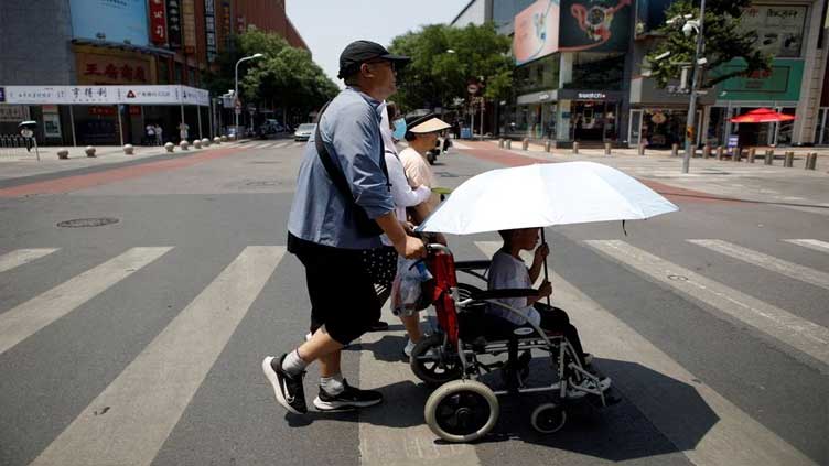 Beijing sweats in extreme heat for record days this year