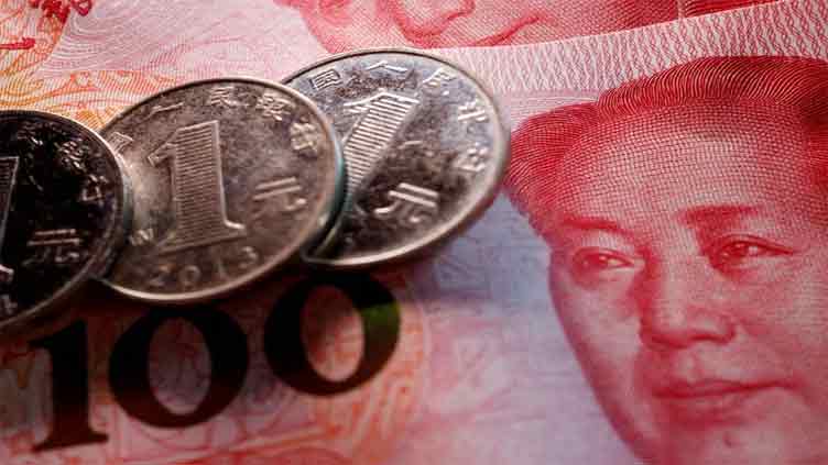China's state banks seen selling dollars offshore to slow yuan decline: sources