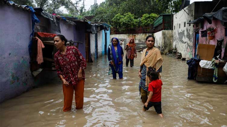 Four killed, hundred feared buried in landslide in India