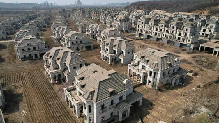 Chinese ghost town of mansions reclaimed by farmers