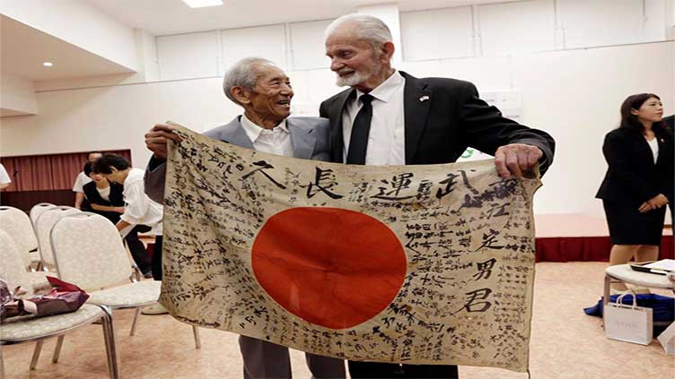 A flag carried by a Japanese soldier who was killed during World War II is returning to his family