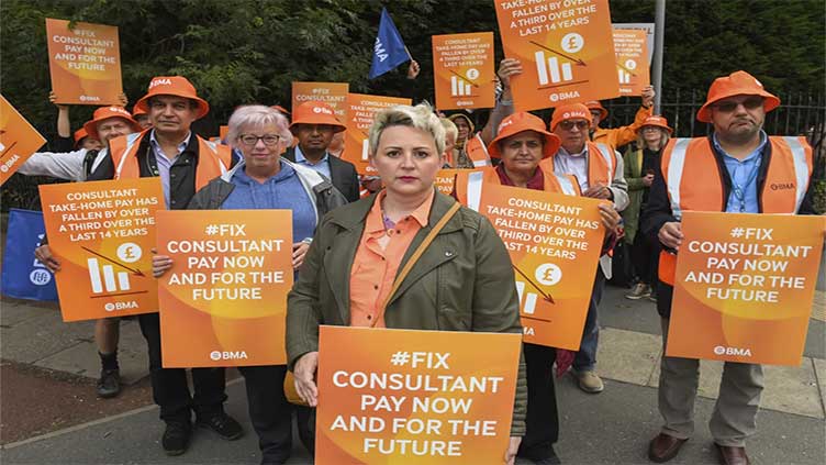 Thousands of UK hospital doctors walk out in the latest pay dispute, crippling health services