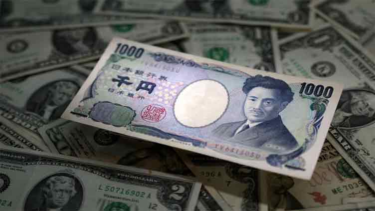 Yen slides, dollar gains as Bank of Japan is expected to maintain loose policy