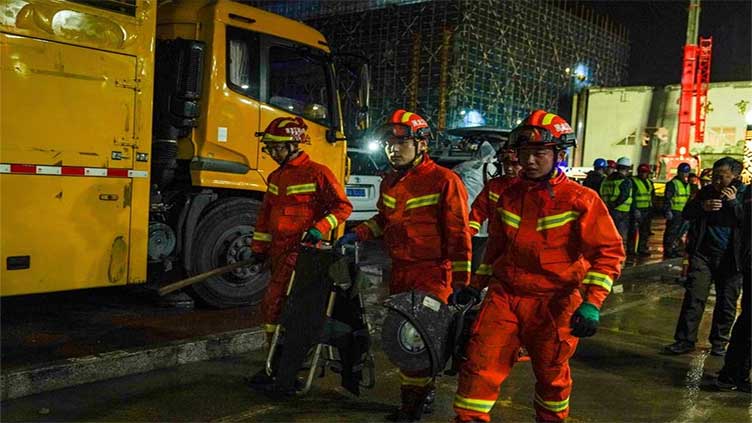 China school gymnasium's roof collapses, killing 11