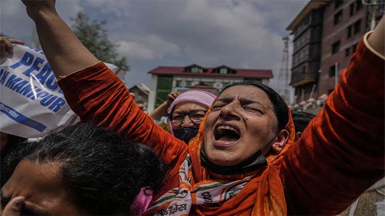 India's Parliament rocked by protests for a third day over ethnic violence in remote state