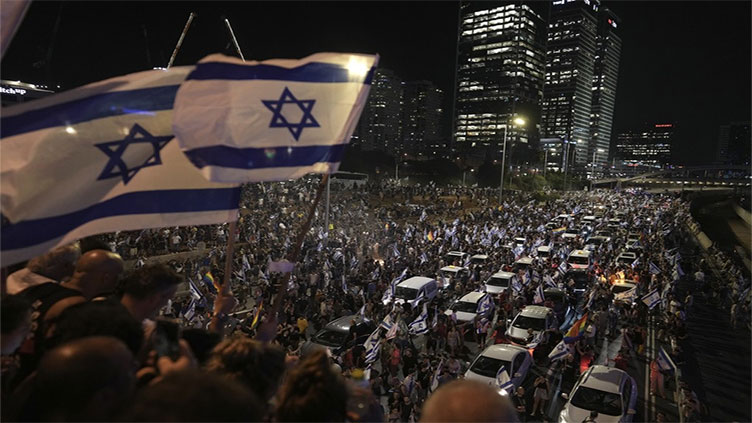 Protests rock Israel as it passes curbs on some Supreme Court powers