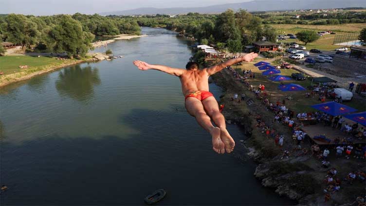 Kosovo bridge divers overcome fear to 'fly' in annual competition