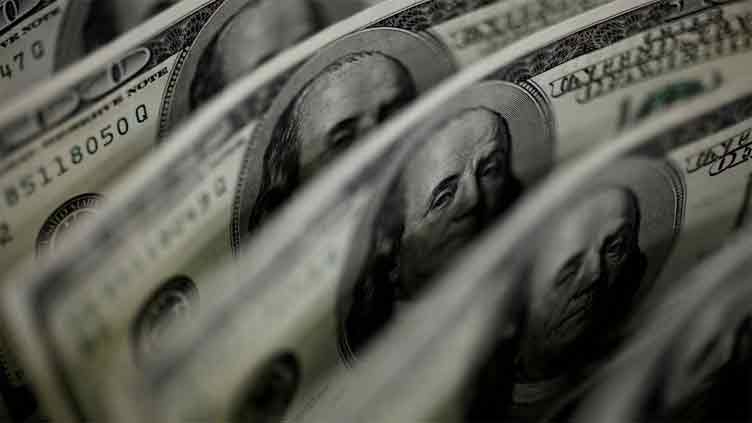 Dollar near two-week high as Fed decision looms, Aussie falls