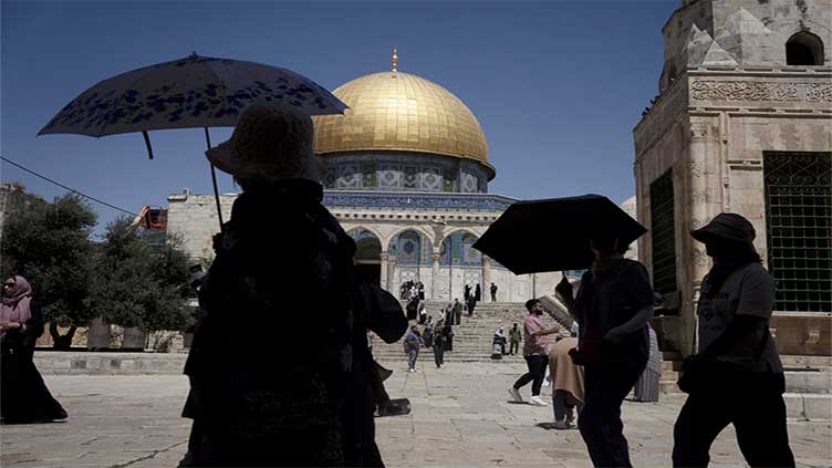 Army fire kills a 14-year-old, Palestinians say, as an Israeli minister visits flashpoint holy site