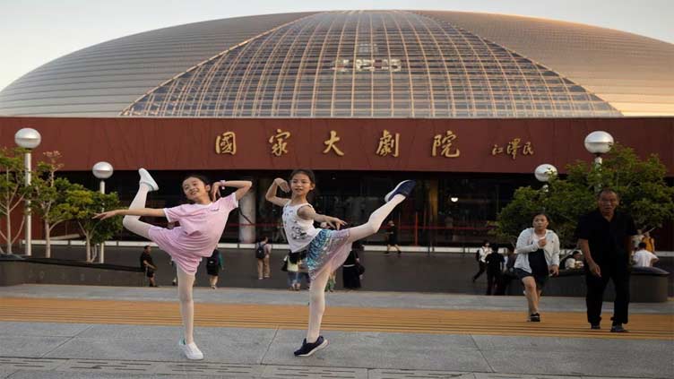 Russia's Bolshoi, performing in China, vows to return to the West