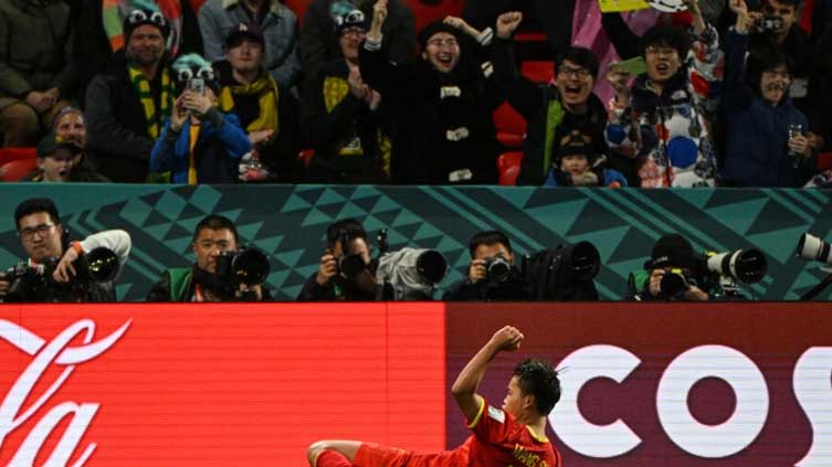 Ten-player China beat Haiti to stay alive after wild World Cup clash