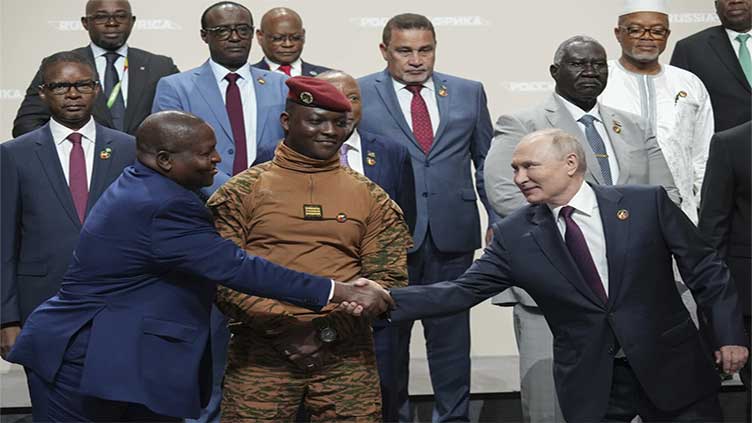 Putin woos African leaders at a summit in Russia with promises of expanding trade and other ties
