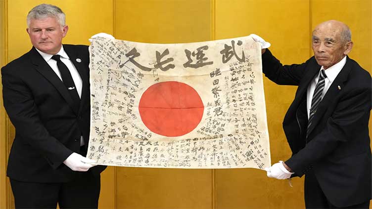 It's a miracle, say family of Japanese soldier killed in WWII, as flag he carried returns from US