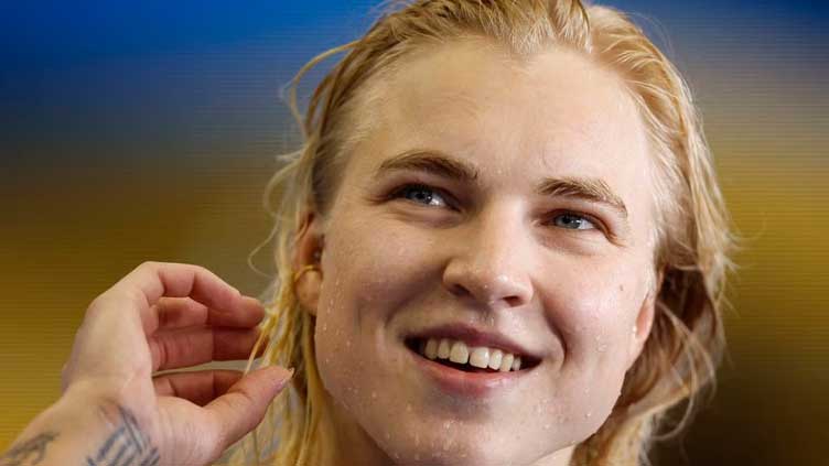 Lithuania's Meilutyte smashes world record, strong finish for US