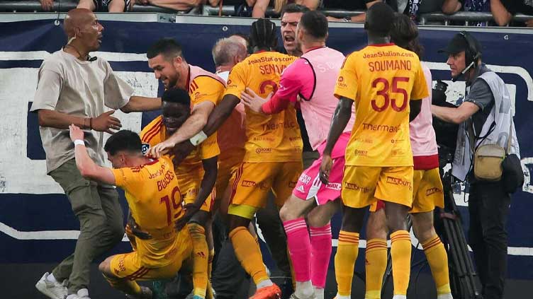 Bordeaux promotion bid in danger after fan assault on Rodez player ends game