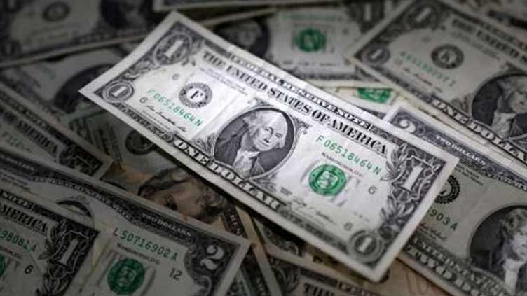 Dollar rallies in Asia after Fed signals rate hikes; yen, kiwi slide