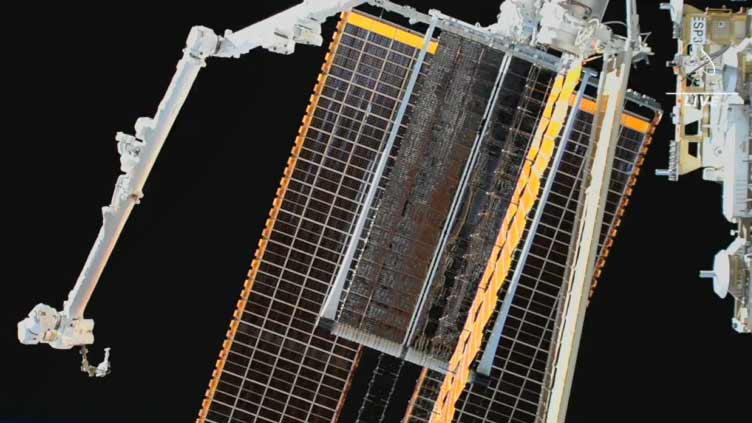 NASA spacewalkers finish installing roll-out solar array