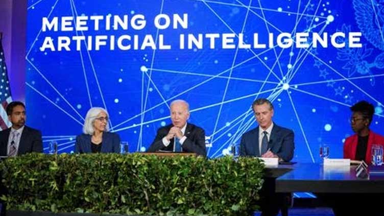 Biden says risks posed by AI to security, economy need addressing