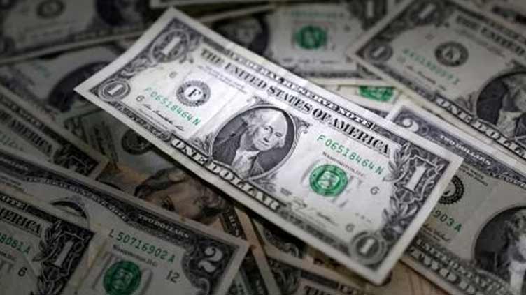 Dollar finds footing on housing data as yuan falters