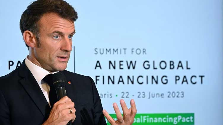 Rich nations finalise $100bn climate aid at Paris summit - Macron