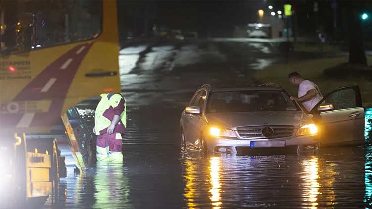 Storms and heavy rain flood roads, block railway lines in Germany