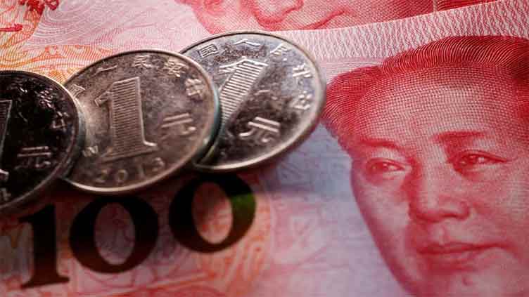 China's state banks seen selling dollars offshore to slow yuan drop: sources