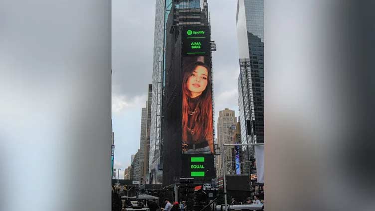 Aima flies high as singer appears at Times Square
