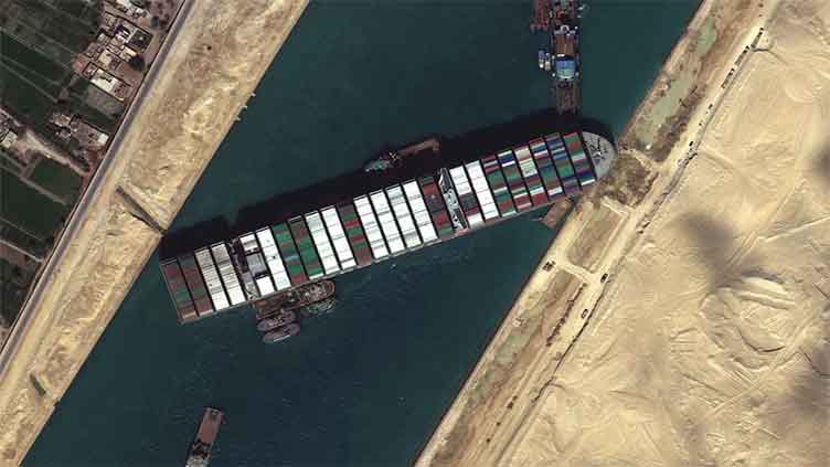 Egypt's Suez Canal tugboats working to move stranded container ship