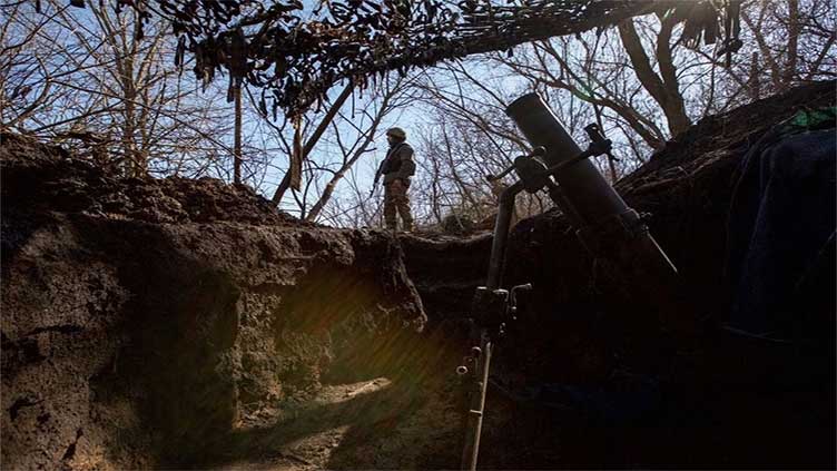 Kyiv says forces are holding on in 'hellish' Bakhmut battle