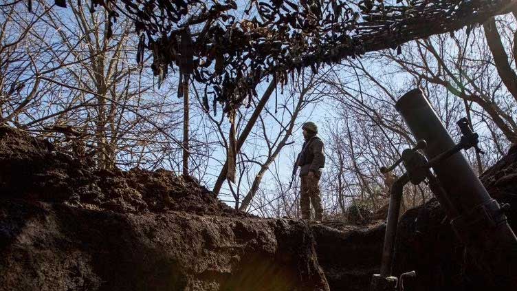 Kyiv says forces are holding on in 'utter hell' of Bakhmut battle