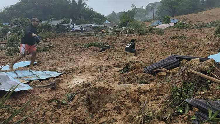 Indonesia landslides kill 10, rescuers search for 42 missing