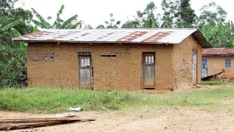 Survivors of deadly raid in east Congo return to torched village