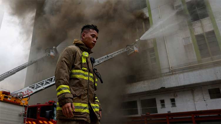 Hong Kong firefighters battle warehouse blaze in densely packed Kowloon