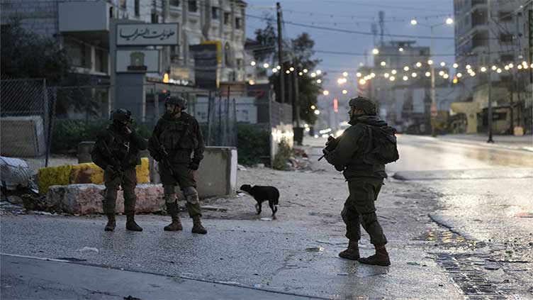 Two wounded in West Bank drive-by shooting - military