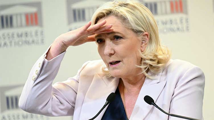 Le Pen lies in wait as Macron's pension reforms roil France