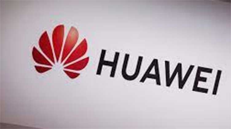 China's Huawei says 'out of crisis' mode as revenue edges up