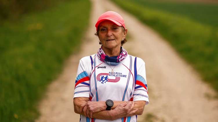 Surrounded by marathon medals, an 83-year-old dreams of Paris