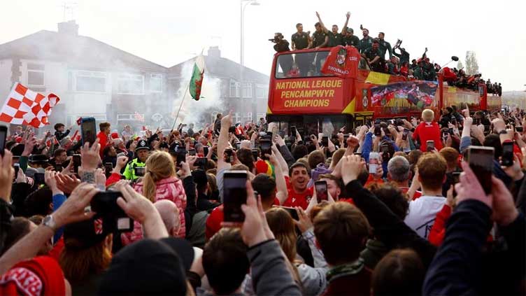 Wrexham paint town red with open-top bus parade after promotion to EFL