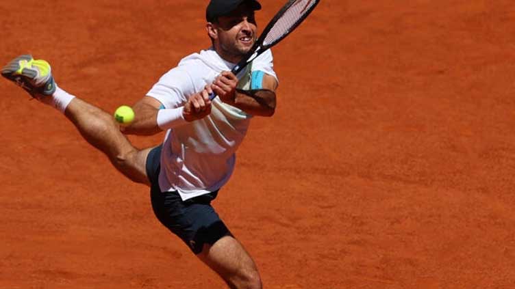 Resurgent Karatsev ends Zhang's groundbreaking run in Madrid