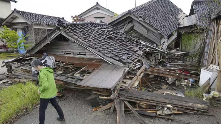 Aftershocks shake Japan after quake kills one, destroys homes